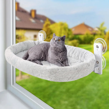 Furvio Shop cordless window cat hammock and sunbed hanging inside a home, providing a cozy perch for cats near a sunny window.