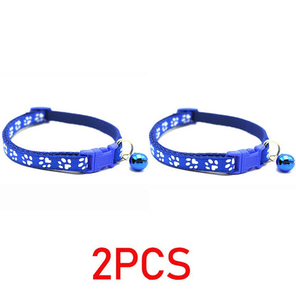Reflective paw print breakaway collar for dogs in vibrant colors, featuring a secure breakaway buckle and adjustable fit.