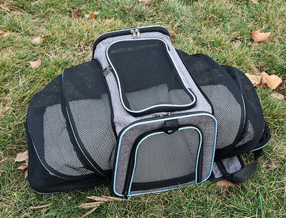 Expandable breathable pet carrier bag by Furvio Shop with mesh sides and adjustable straps for comfortable pet travel.