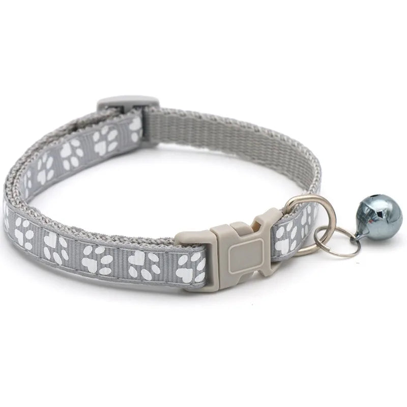 Reflective paw print breakaway cat collar from FurvioShop with safety buckle and adjustable fit in vibrant colors.