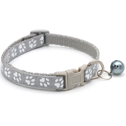 Reflective paw print breakaway cat collar from FurvioShop with safety buckle and adjustable fit in vibrant colors.