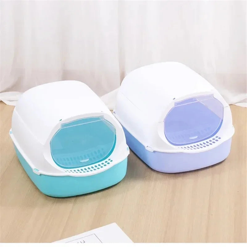 Semi-enclosed splashproof cat litter box by Furvio Shop with high sides and a door for easy access and containment.