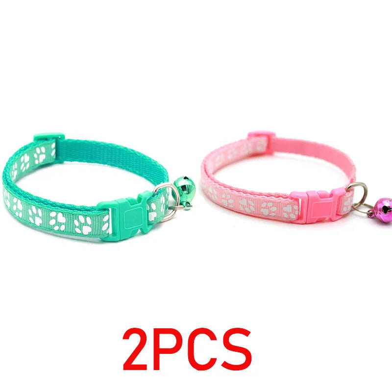 Reflective paw print breakaway dog collar by Furvio Shop featuring a black strap with reflective paw print design.