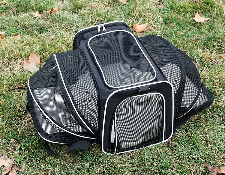 Expandable breathable Furvio Shop pet carrier bag with mesh panels and adjustable straps for comfortable pet travel.