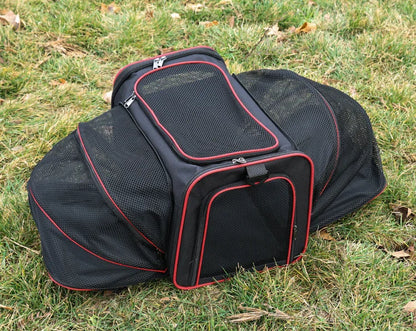 Expandable breathable pet carrier bag by Furvio Shop showing mesh sides, zipper extension, and comfortable carrying handles.