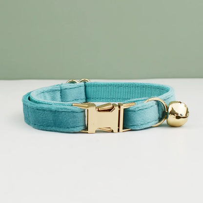 Velvet cat collar by Furvio Shop with a bowknot, bell, and personalized tag, designed for stylish and comfortable cat accessories.