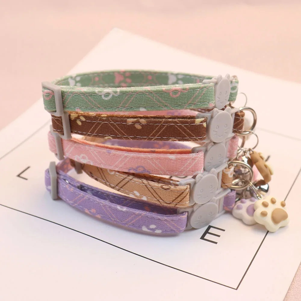 Colorful patterned breakaway cat collar with a bell from Furvio Shop, featuring a secure breakaway buckle and adjustable fit.