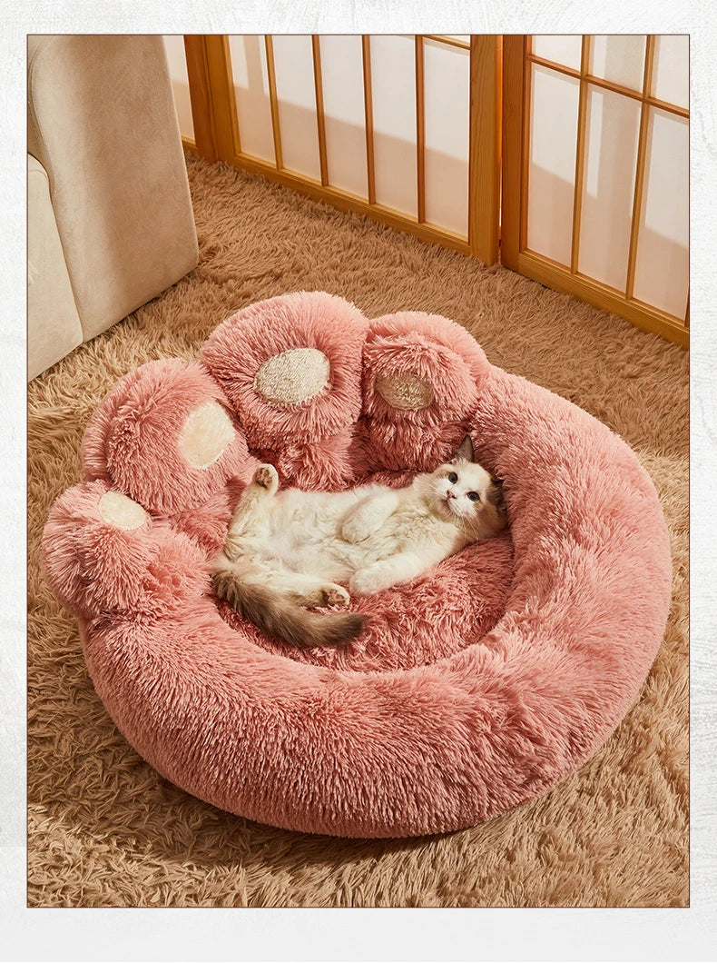 Ultra-soft plush paw-shaped pet bed by Furvio Shop, designed for winter warmth and cozy comfort for small pets.