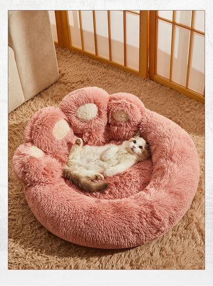 Ultra-soft plush paw-shaped pet bed by Furvio Shop, designed for winter warmth and cozy comfort for small pets.