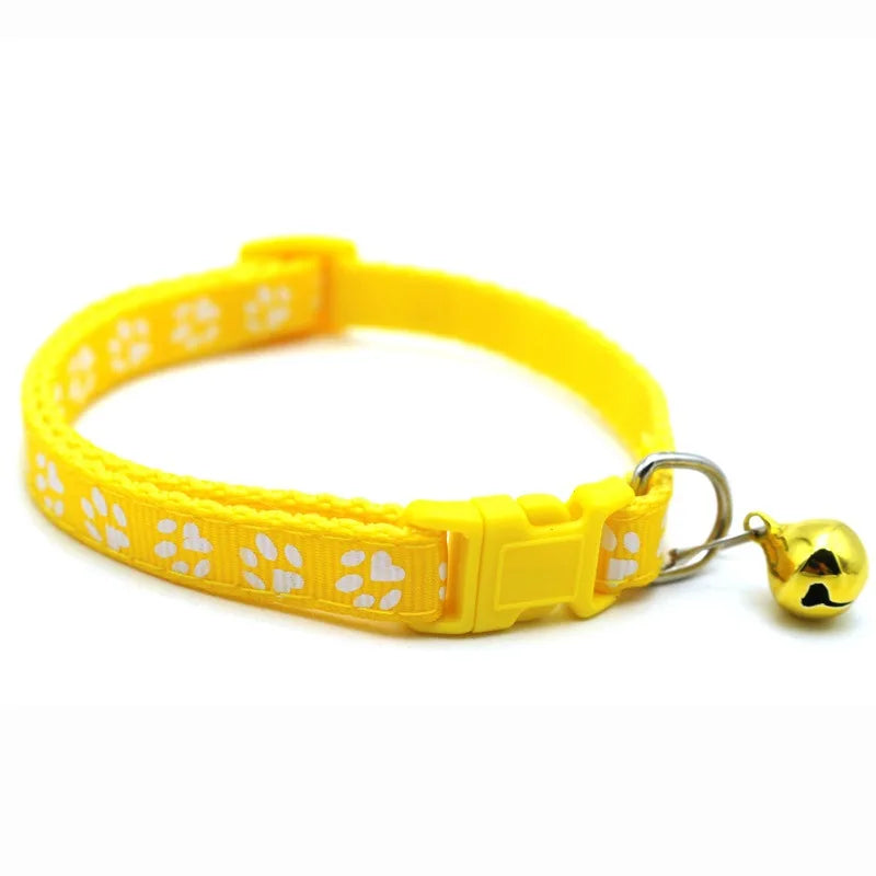 Reflective paw print breakaway dog collar by Furvio Shop, showing a close-up of the collar with reflective paw print pattern.