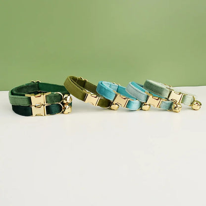 Velvet cat collar with bowknot, personalized Furvio Shop design, includes bell and adjustable belt for cats.