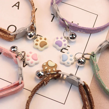 Patterned breakaway cat collar with bell from Furvio Shop, featuring colorful design and safety breakaway clasp.