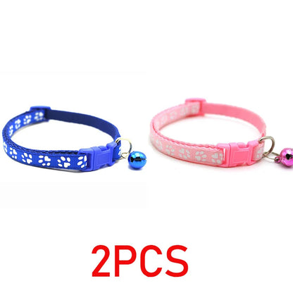 Reflective paw print breakaway collar for pets with a secure buckle, featuring a vibrant design and safety reflective details.
