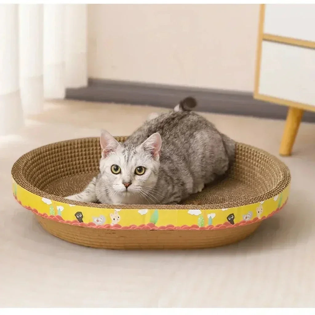 Oval corrugated cat scratcher and lounge bed by Furvio Shop, featuring a cozy, textured surface for scratching and resting.
