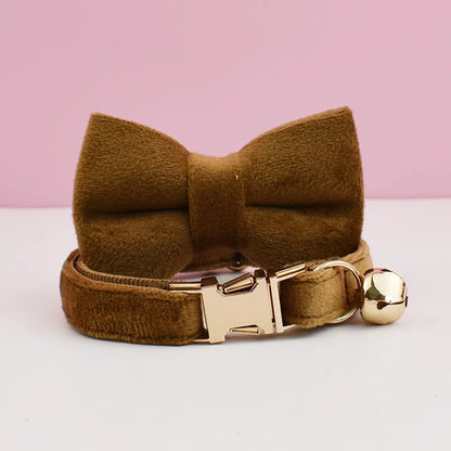 Luxury velvet cat collar from Furvio Shop featuring a decorative bow tie and adjustable clasp.