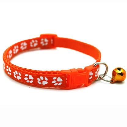 Reflective paw print breakaway dog collar from Furvio Shop with adjustable strap and safety release, designed for pet visibility.