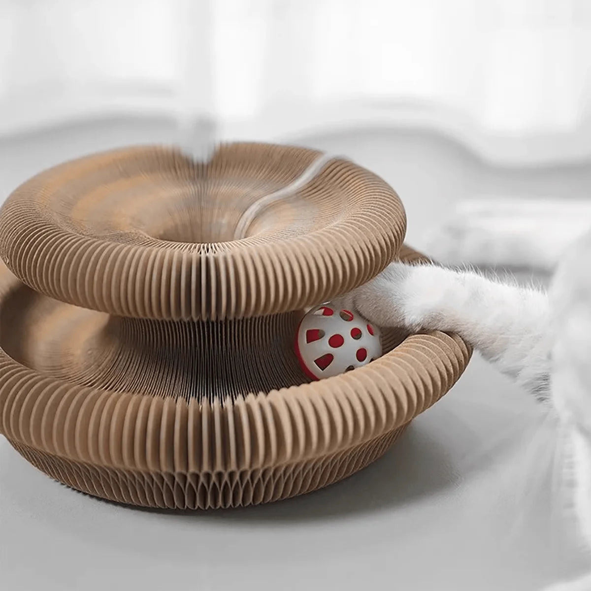 Furvio Shop transformable accordion cat scratcher and ball track with multiple levels and scratching surfaces for feline entertainment.