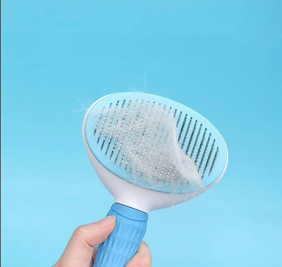 Furvio Shop self-cleaning pet grooming brush with ergonomic handle and stainless steel bristles for gentle fur removal