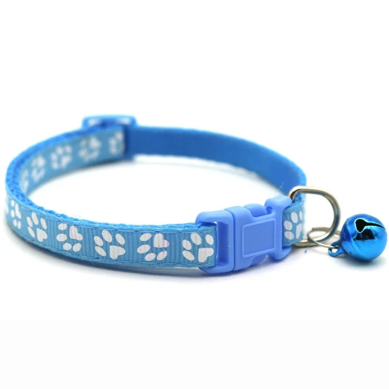 Reflective paw print breakaway dog collar with adjustable strap and safety buckle, featuring a Furvio Shop logo on the tag.