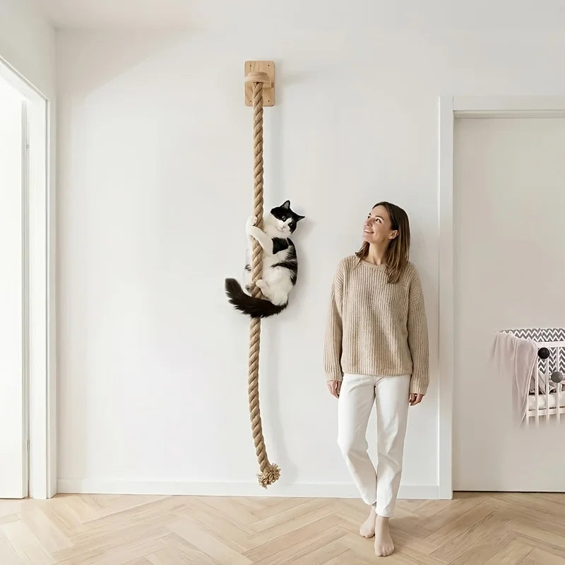 Wall-mounted minimalist cat climbing rope by Furvio Shop, featuring natural sisal rope and sleek wooden mounting brackets.