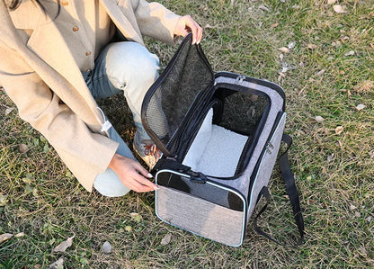 Expandable breathable pet carrier bag by Furvio Shop showing mesh panels, zipper opening, and padded handles for comfortable carrying.