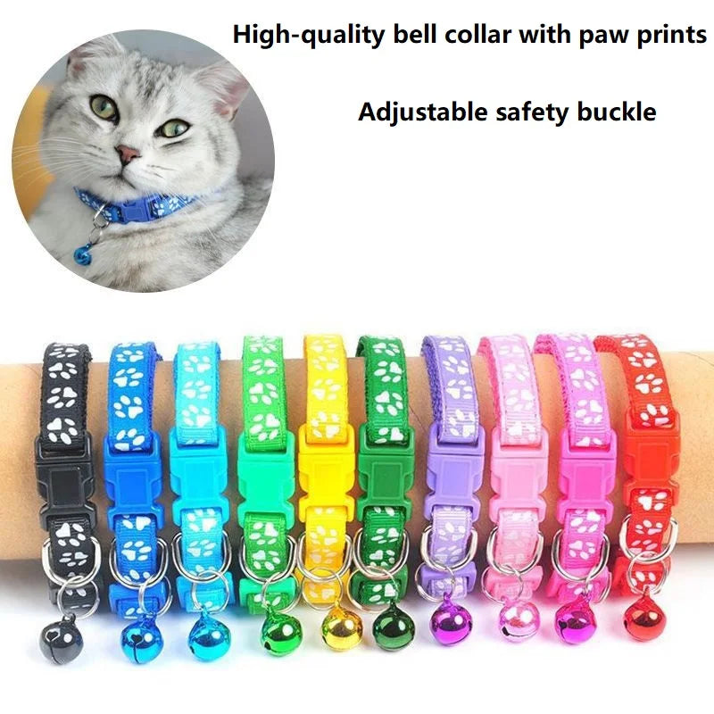 Reflective paw print breakaway dog collar by Furvio Shop with adjustable strap and safety buckle, featuring a black background with paw print pattern.