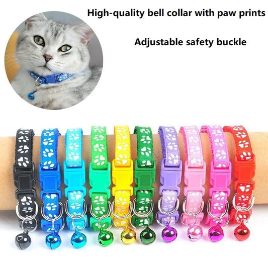 Reflective paw print breakaway dog collar by Furvio Shop with adjustable strap and safety buckle, featuring a black background with paw print pattern.