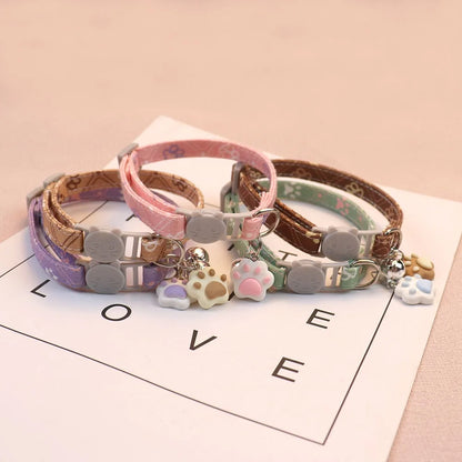 Patterned breakaway cat collar with bell from Furvio Shop, featuring colorful design and secure breakaway clasp.